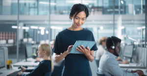 finance professional using Rossum's AI-powered document processing on tablet
