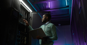 IT professional using cloud security solution on laptop