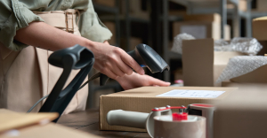Employee at CPG business scanning box