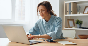 HR professional using document automation on laptop