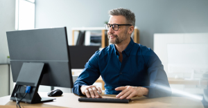 CFO using automated document processing on desktop computer