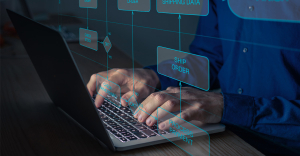 Hands typing on a keyboard with graphics overlaid showing workflow process mapping.