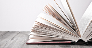 A book with pages showing, to represent intelligent document processing glossary.