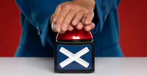 Hands pushing a large red button on a box marked with an X. The OCR vs IDP battle rages on.
