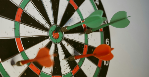 Image with a dart board sprinkled with darts, to depict the challenges in reaching high OCR accuracy.