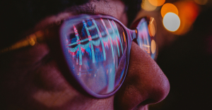 Person looking at view while wearing sunglasses, to represent analyzing automation statistics.