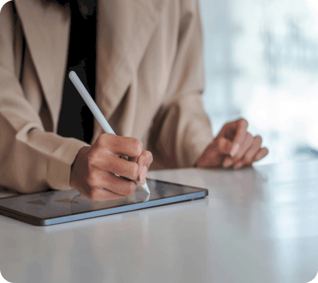 AI benefits for invoice processing - person writing on a tablet