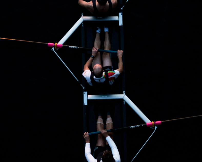 People rowing aimed to represent the integration between Rossum & Netsuite